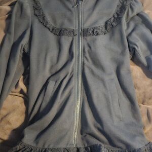 Elegant Black Teddy Jacket with Ruffle Trim